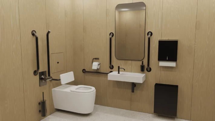 An inclusive, disability-friendly public restroom with natural-looking wood walls, a toilet, a sink and rails in black