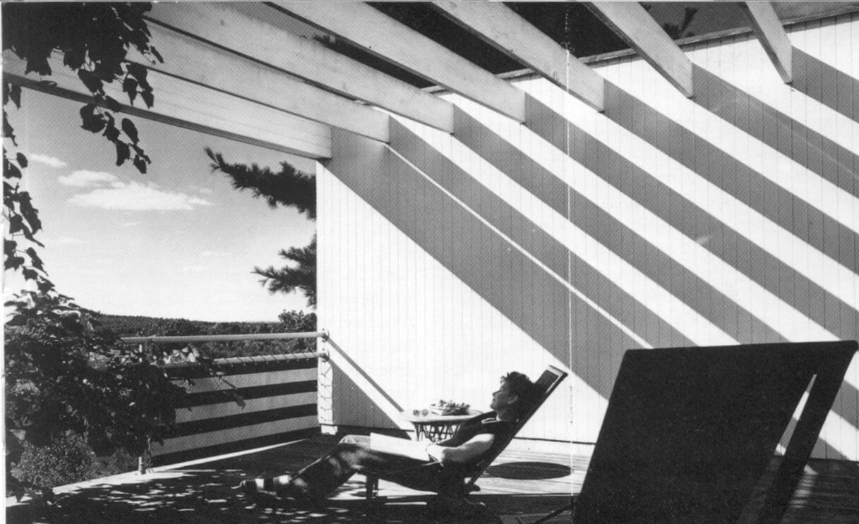 Black and white image of a woman reclining in a sun-lounger on the balcony of Gropius House (Lincoln, US) by Walter Gropius, 1938
